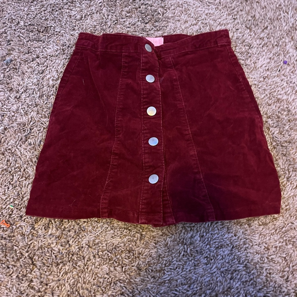 A maroon corduroy skirt